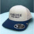 TravisMathew Carlyle Global Wealth 110 Flexfit Tech Mesh Snapback Hat NWT Golf